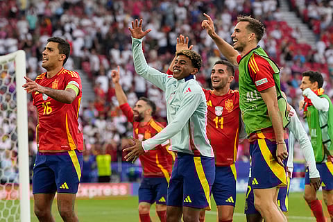 Spain players celebrate after the quarterfinal match against Germany
